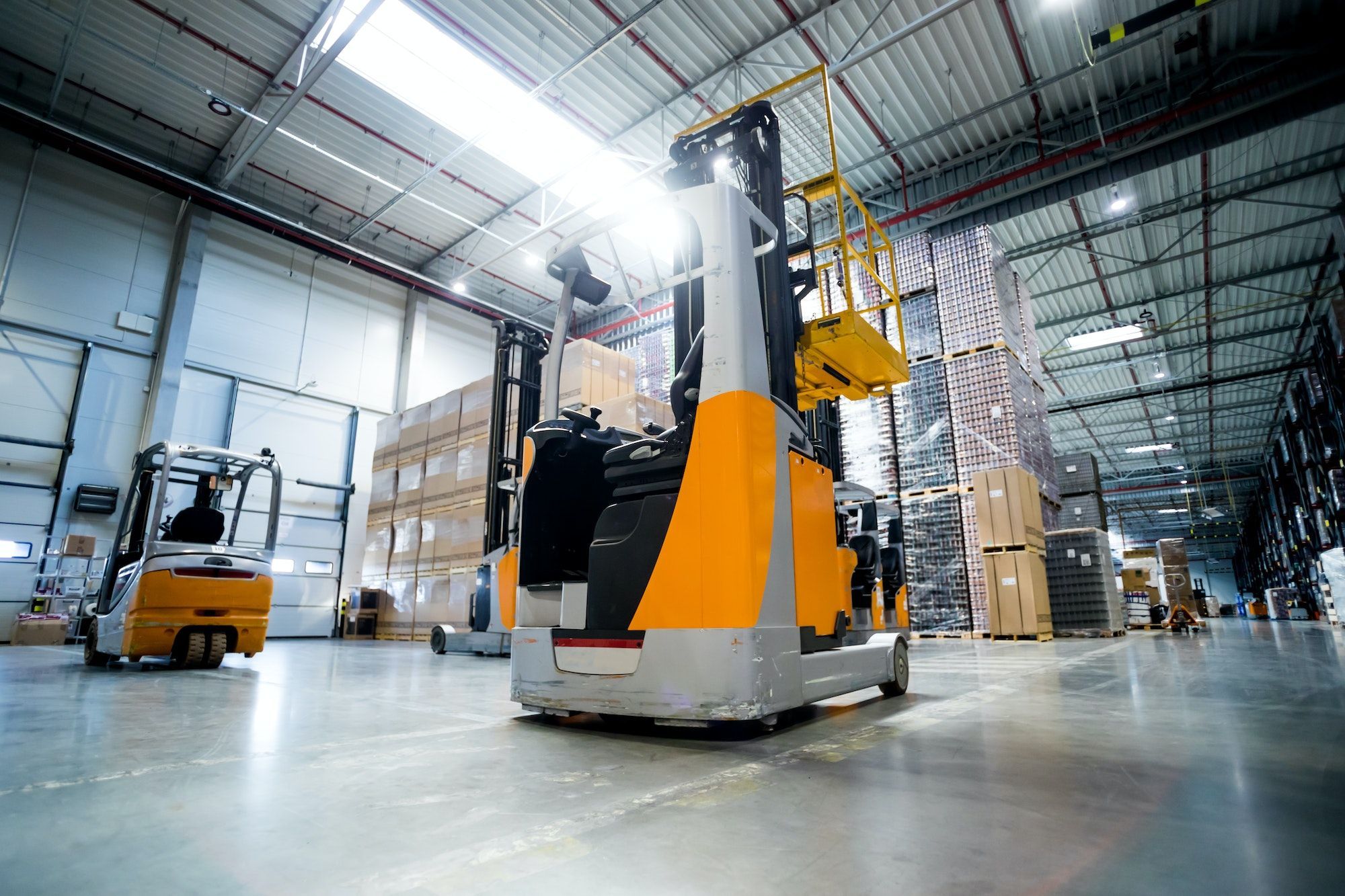 Forklift in huge warehouse